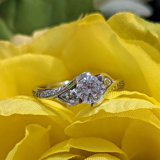 Photo of "Poppy" Ring in a decorative scene, designed by , available at Plumb Gold & Plumb Silver