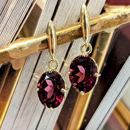 Photo of Rhodolite Dangles in a decorative scene, designed by , available at Plumb Gold & Plumb Silver