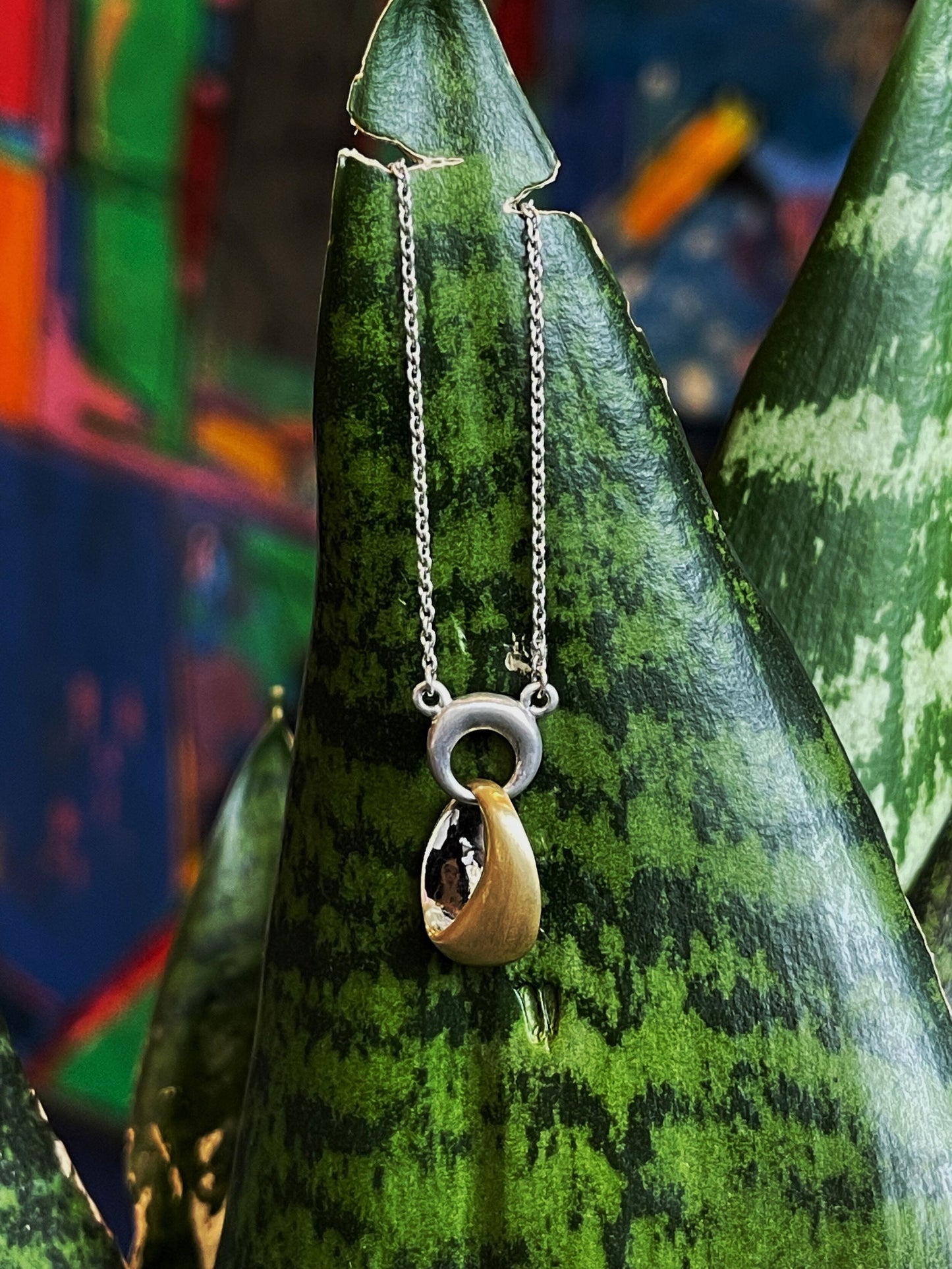 Photo of "Ronda" Necklace in a decorative scene, designed by , available at Plumb Gold & Plumb Silver