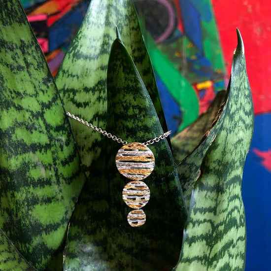 Photo of Rope Pendant in a decorative scene, designed by , available at Plumb Gold & Plumb Silver