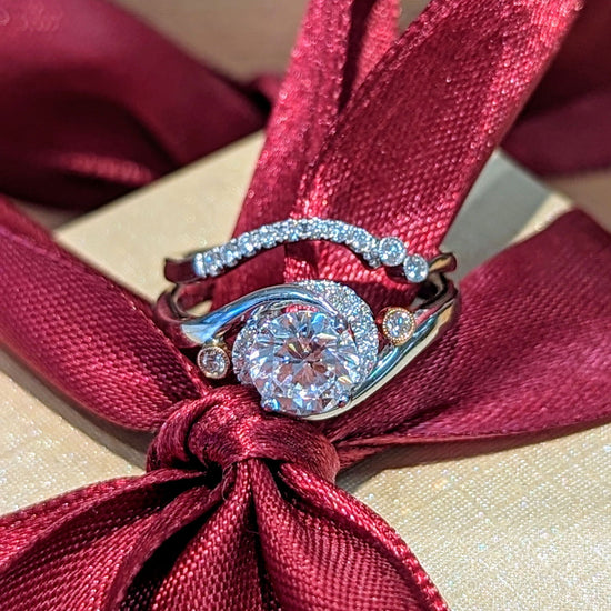 Photo of "Rose" Botanical Swirl Engagement Ring or Band in a decorative scene, designed by , available at Plumb Gold & Plumb Silver