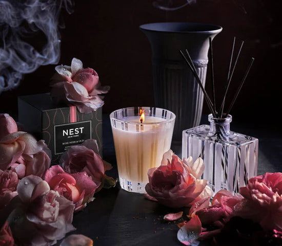Photo of Rose Noir & Oud Candle in a decorative scene, designed by , available at Plumb Gold & Plumb Silver