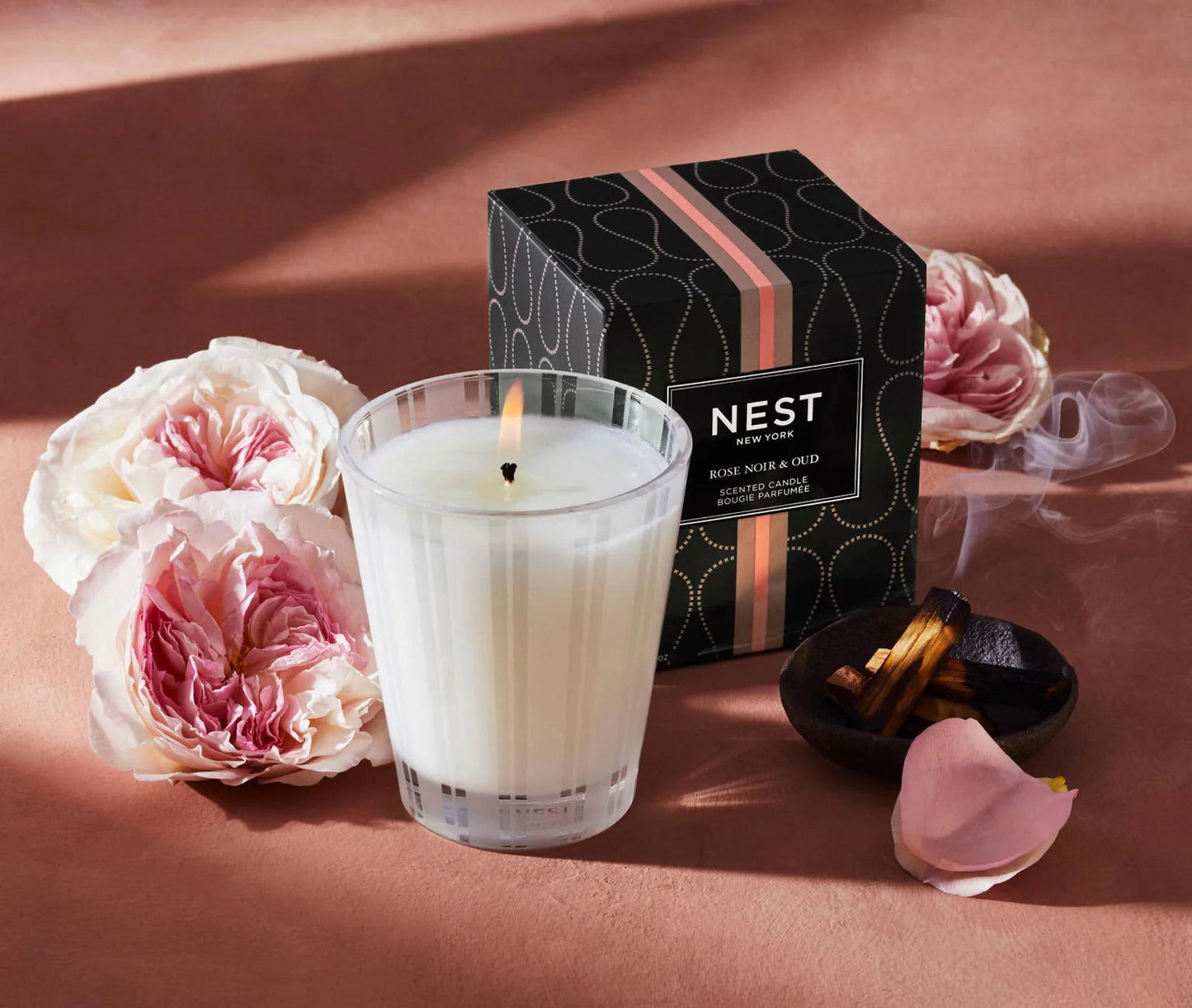 Photo of Rose Noir & Oud Candle in a decorative scene, designed by , available at Plumb Gold & Plumb Silver