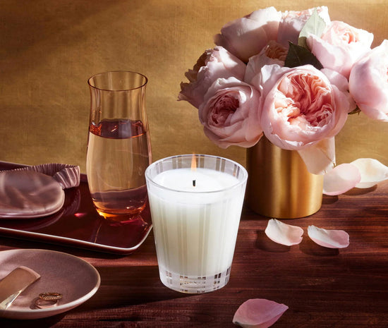 Photo of Rose Noir & Oud Candle in a decorative scene, designed by , available at Plumb Gold & Plumb Silver