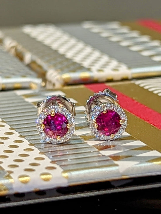 Photo of Ruby Halo Studs in a decorative scene, designed by , available at Plumb Gold & Plumb Silver