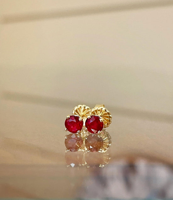 Photo of Ruby Studs in a decorative scene, designed by , available at Plumb Gold & Plumb Silver