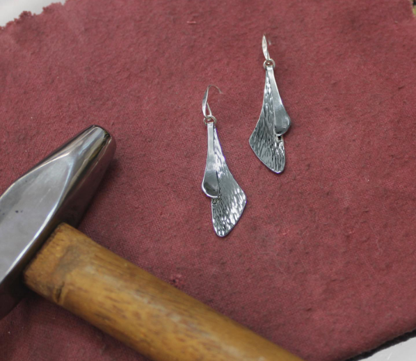 Photo of "Samara" Earrings in a decorative scene, designed by , available at Plumb Gold & Plumb Silver