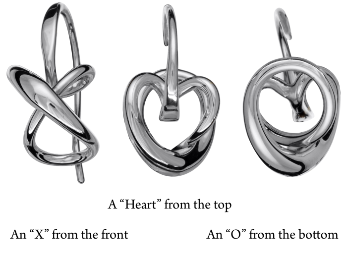 Photo of "Secret Heart" Earrings in a decorative scene, designed by , available at Plumb Gold & Plumb Silver