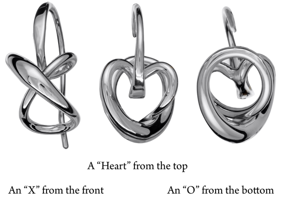 Photo of "Secret Heart" Earrings in a decorative scene, designed by , available at Plumb Gold & Plumb Silver