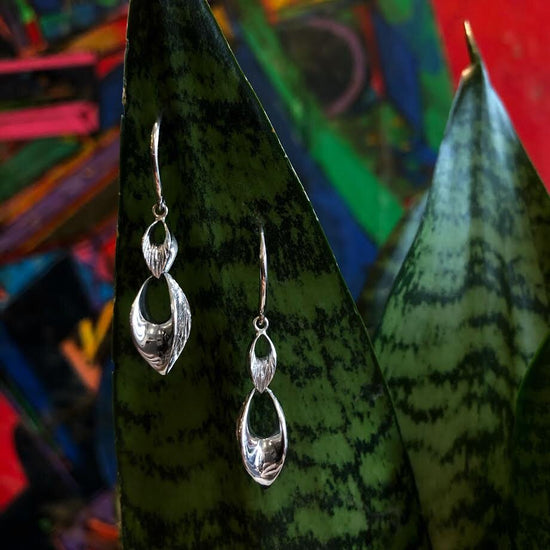 Photo of "Seeds" Earring in a decorative scene, designed by , available at Plumb Gold & Plumb Silver