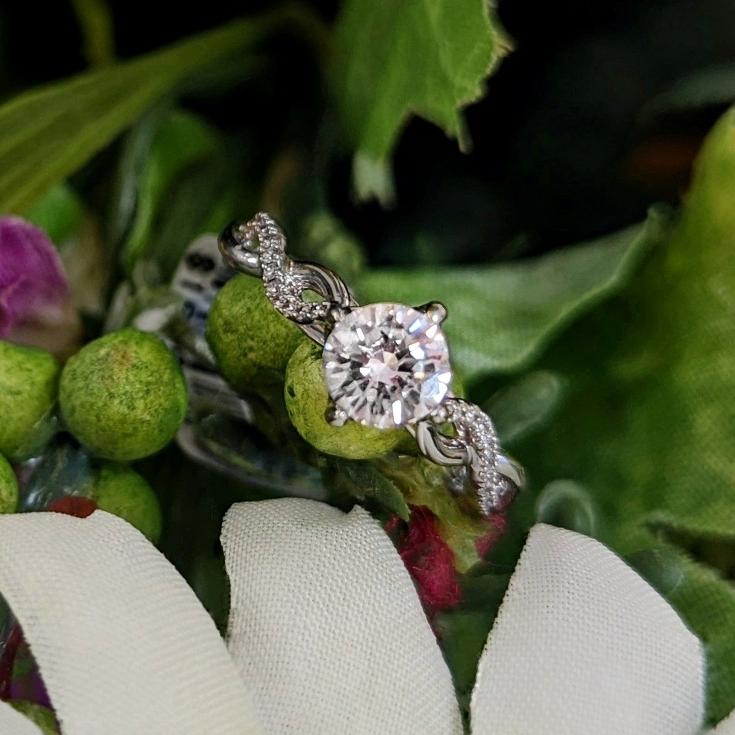 Photo of "Selena" Engagement Ring in a decorative scene, designed by , available at Plumb Gold & Plumb Silver