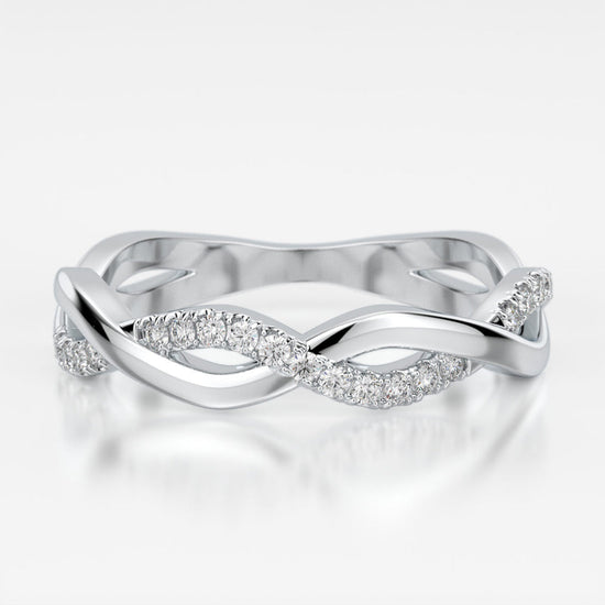 Photo of "Selena" twist band in a decorative scene, designed by , available at Plumb Gold & Plumb Silver