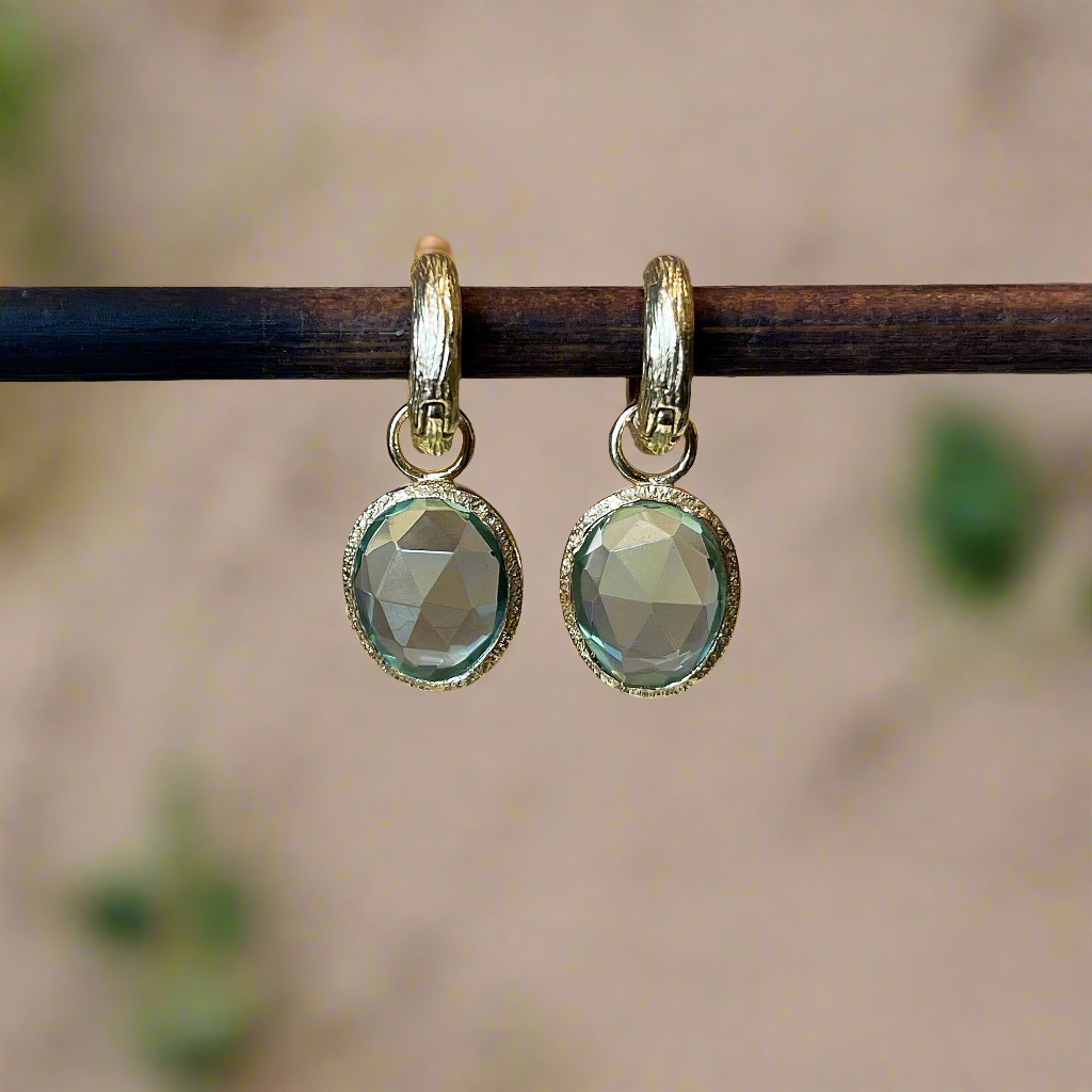 Photo of “Shade” Green Quartz Dangles in a decorative scene, designed by , available at Plumb Gold & Plumb Silver