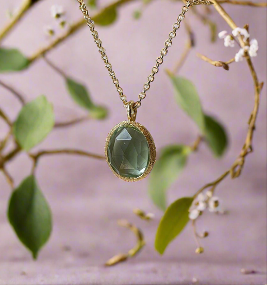 Photo of “Shade” Green Quartz Pendant in a decorative scene, designed by , available at Plumb Gold & Plumb Silver
