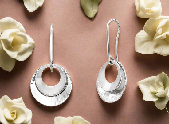 Photo of "Shimmer" Earrings in a decorative scene, designed by , available at Plumb Gold & Plumb Silver