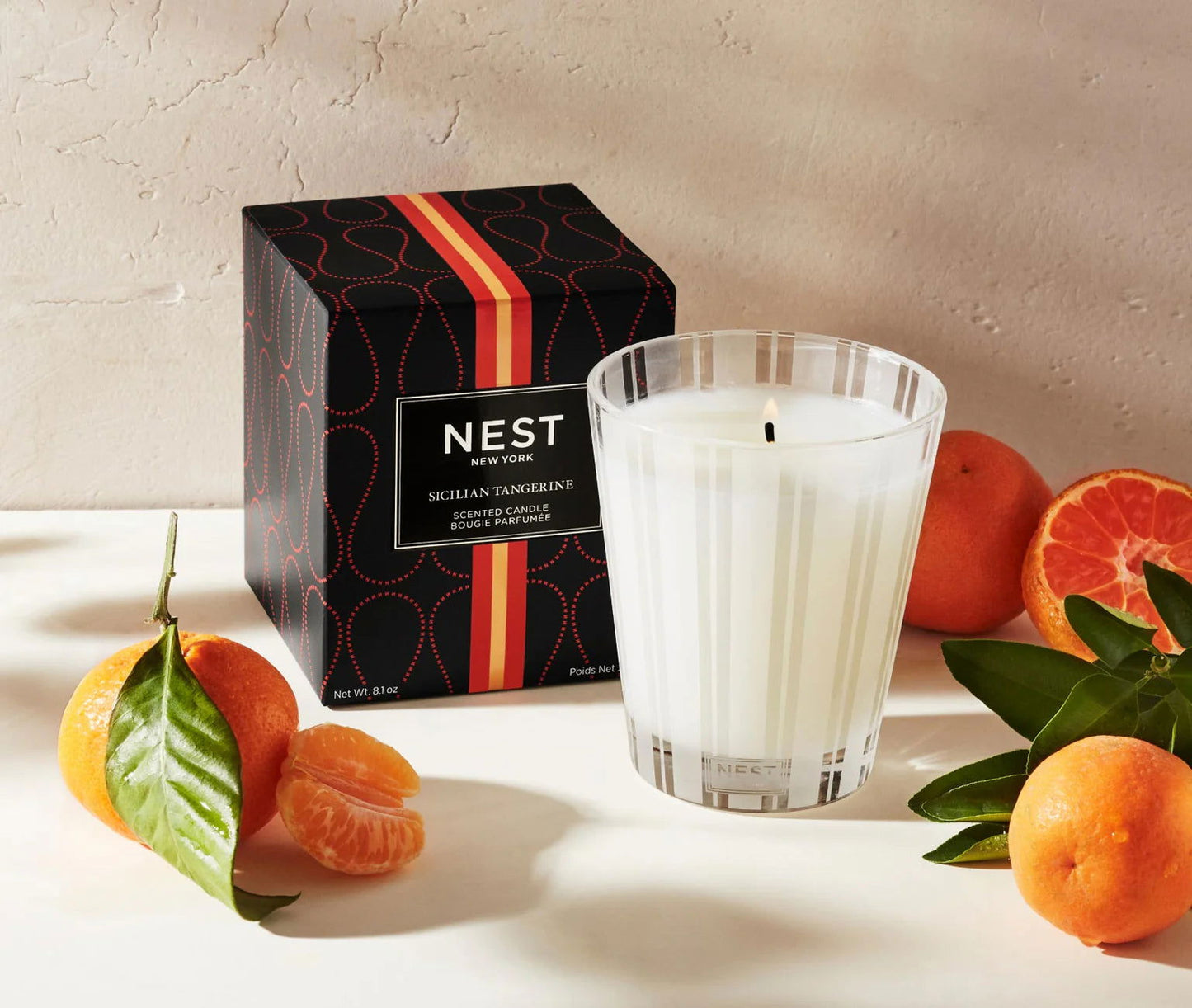 Photo of Sicilian Tangerine Classic Candle in a decorative scene, designed by , available at Plumb Gold & Plumb Silver