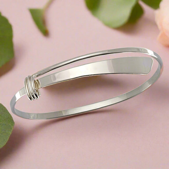 Photo of "Slide" Bracelet in a decorative scene, designed by , available at Plumb Gold & Plumb Silver