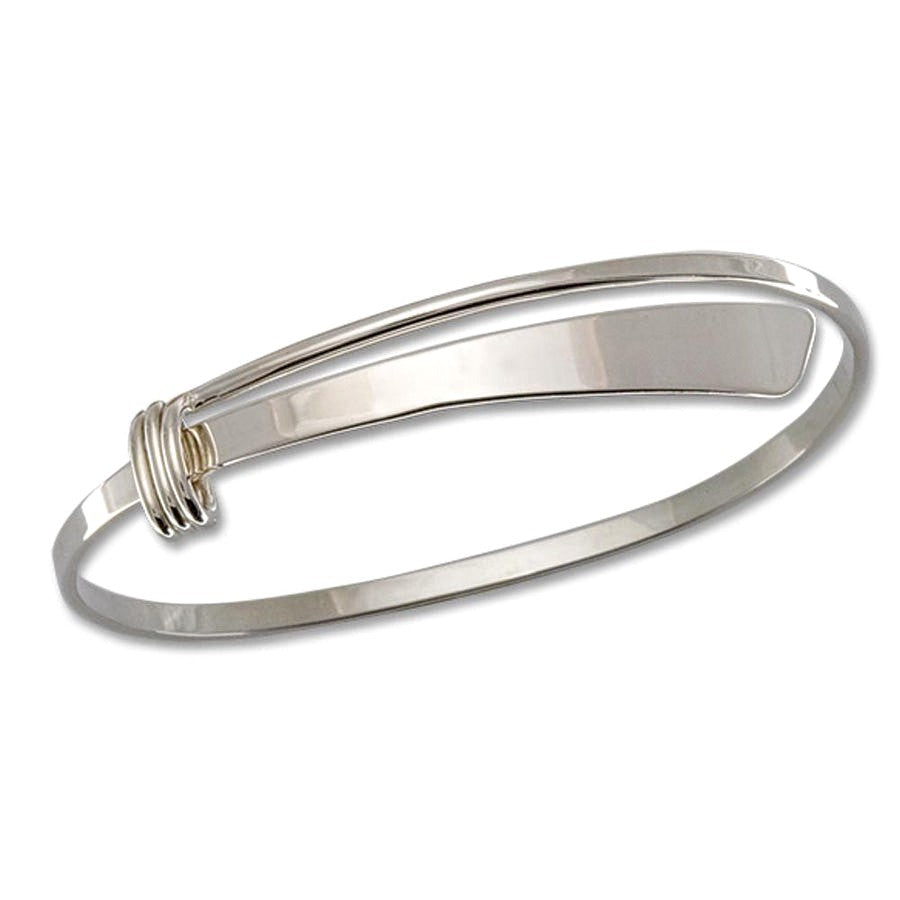 Photo of "Slide" Bracelet in a decorative scene, designed by , available at Plumb Gold & Plumb Silver