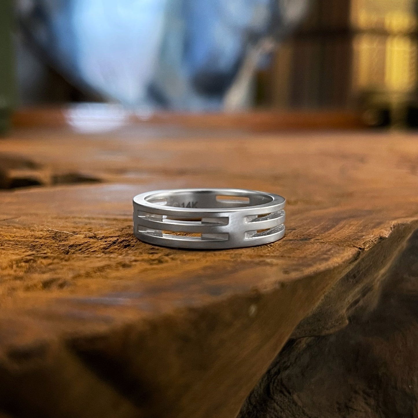 Photo of Slotted Matte Band in a decorative scene, designed by , available at Plumb Gold & Plumb Silver
