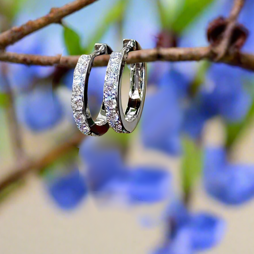 Photo of Small Diamond Huggies in a decorative scene, designed by , available at Plumb Gold & Plumb Silver