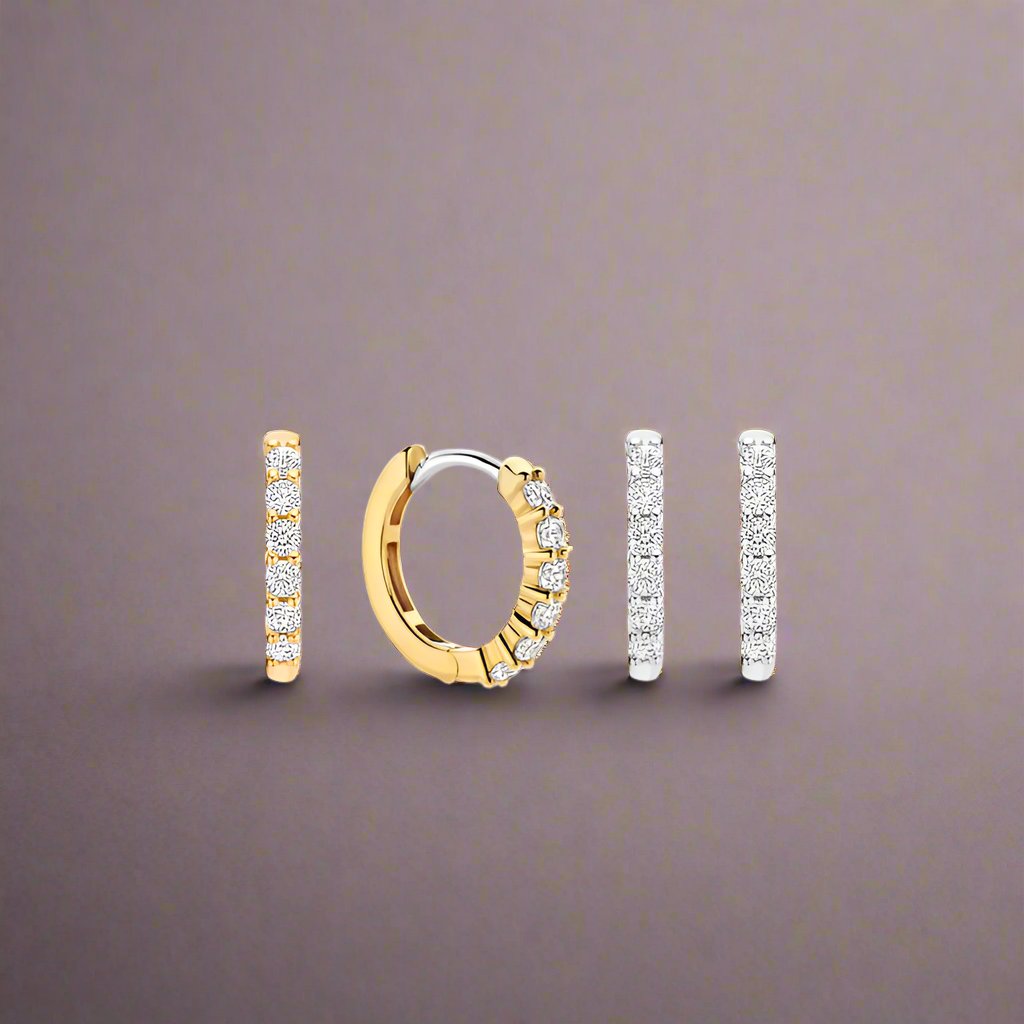 Photo of Small Pavé CZ Hoops in a decorative scene, designed by -, available at Plumb Gold & Plumb Silver