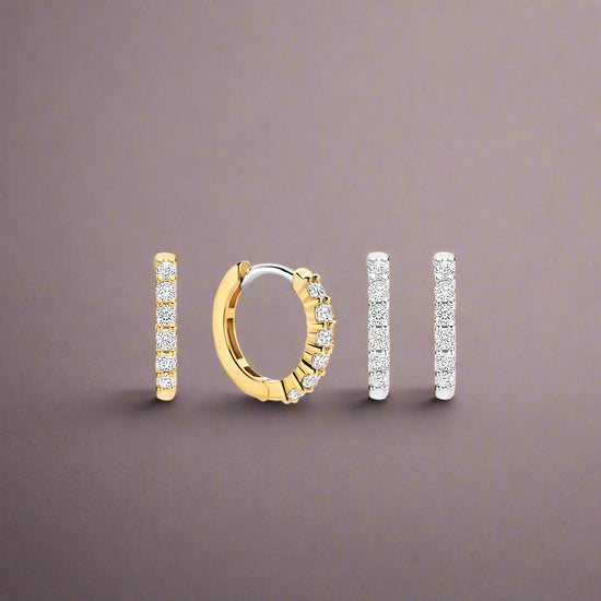Photo of Small Pavé CZ Hoops in a decorative scene, designed by -, available at Plumb Gold & Plumb Silver