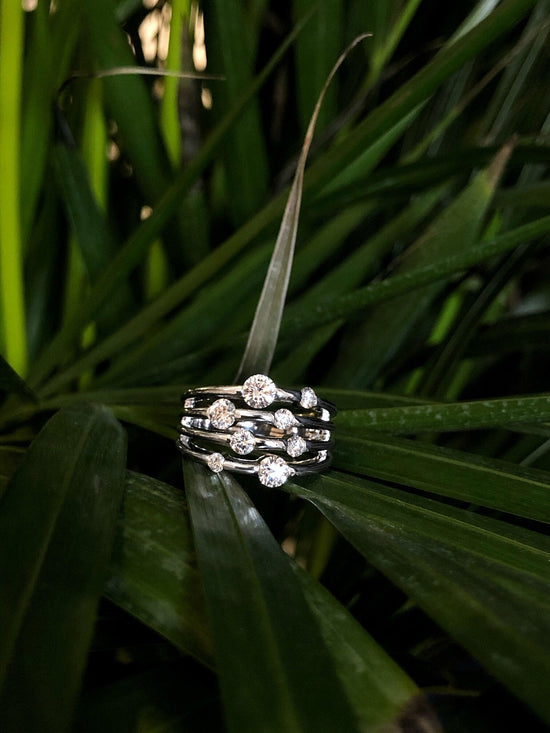 Photo of "Solaris" Band in a decorative scene, designed by , available at Plumb Gold & Plumb Silver