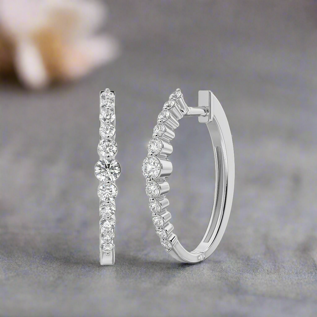 Photo of "Sonya" Diamond Hoops in a decorative scene, designed by , available at Plumb Gold & Plumb Silver