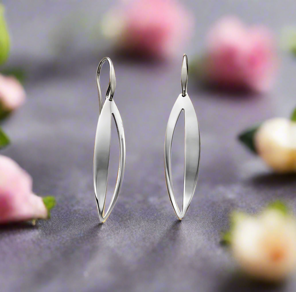 Photo of "Spinner" Earring in a decorative scene, designed by , available at Plumb Gold & Plumb Silver