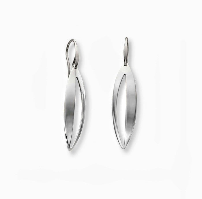Photo of "Spinner" Earring in a decorative scene, designed by , available at Plumb Gold & Plumb Silver