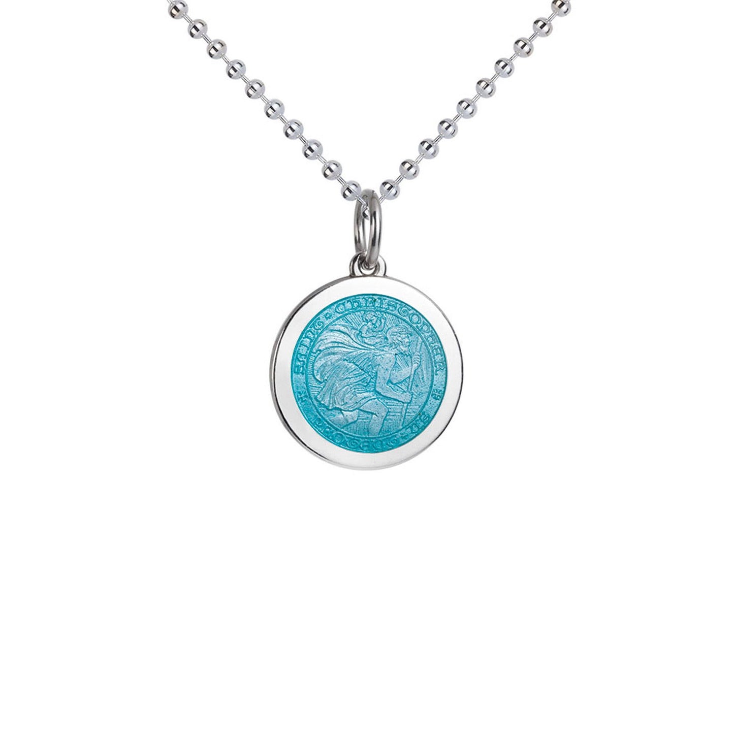 Photo of St. Christopher Pendant in a decorative scene, designed by , available at Plumb Gold & Plumb Silver