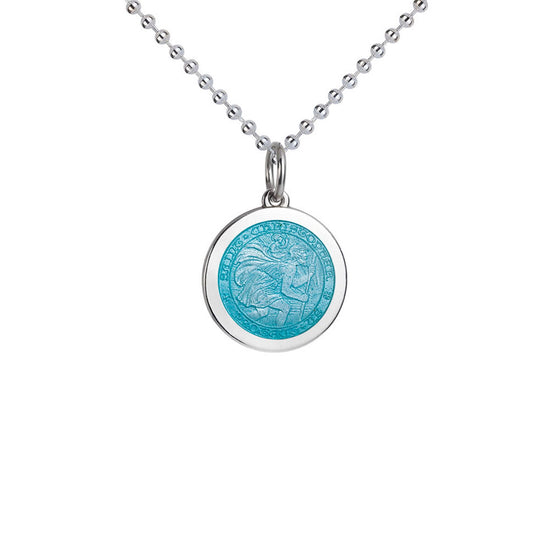 Photo of St. Christopher Pendant in a decorative scene, designed by , available at Plumb Gold & Plumb Silver