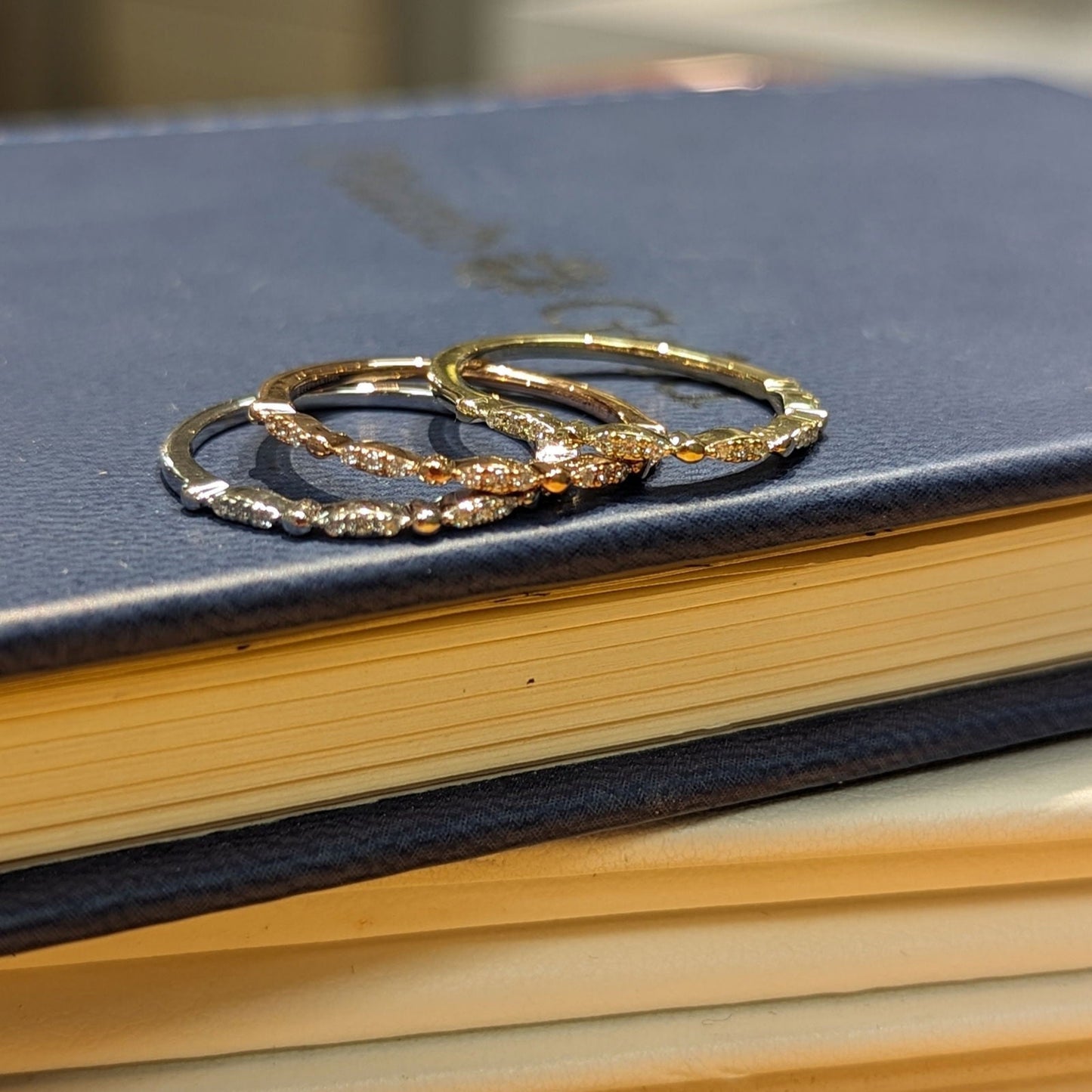 Photo of Stackable Rings in a decorative scene, designed by , available at Plumb Gold & Plumb Silver
