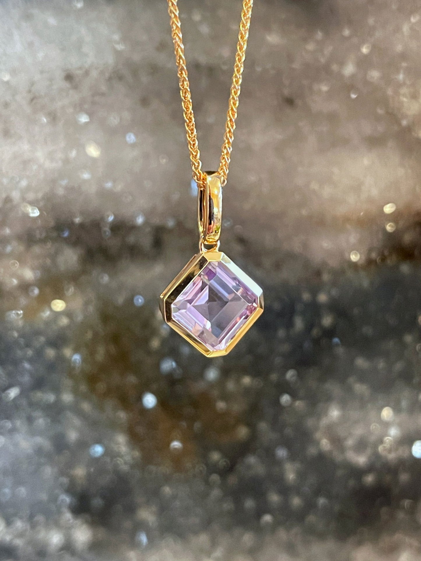 Photo of Stanton Color Lavander Amethyst Pendant in a decorative scene, designed by , available at Plumb Gold & Plumb Silver