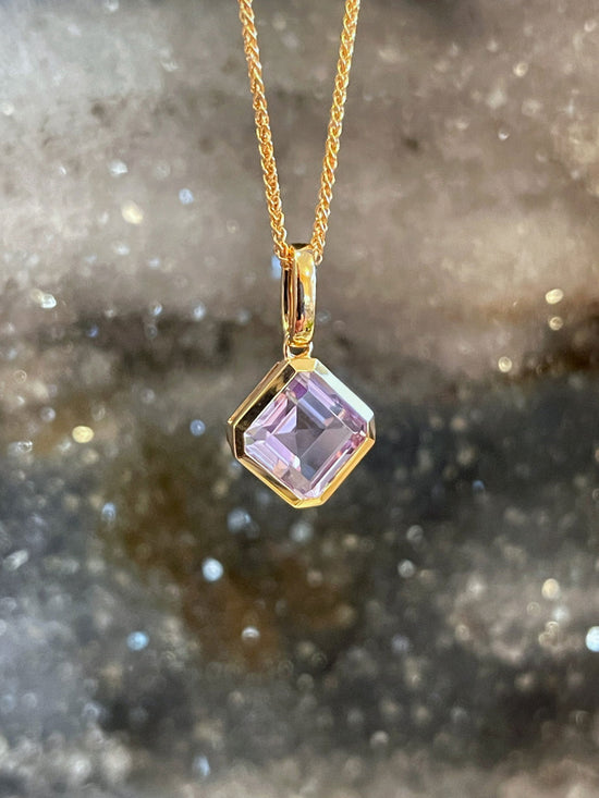 Photo of Stanton Color Lavander Amethyst Pendant in a decorative scene, designed by , available at Plumb Gold & Plumb Silver