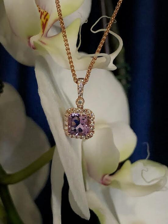 Photo of Stanton Color Rose de France Amethyst Pendant in a decorative scene, designed by , available at Plumb Gold & Plumb Silver
