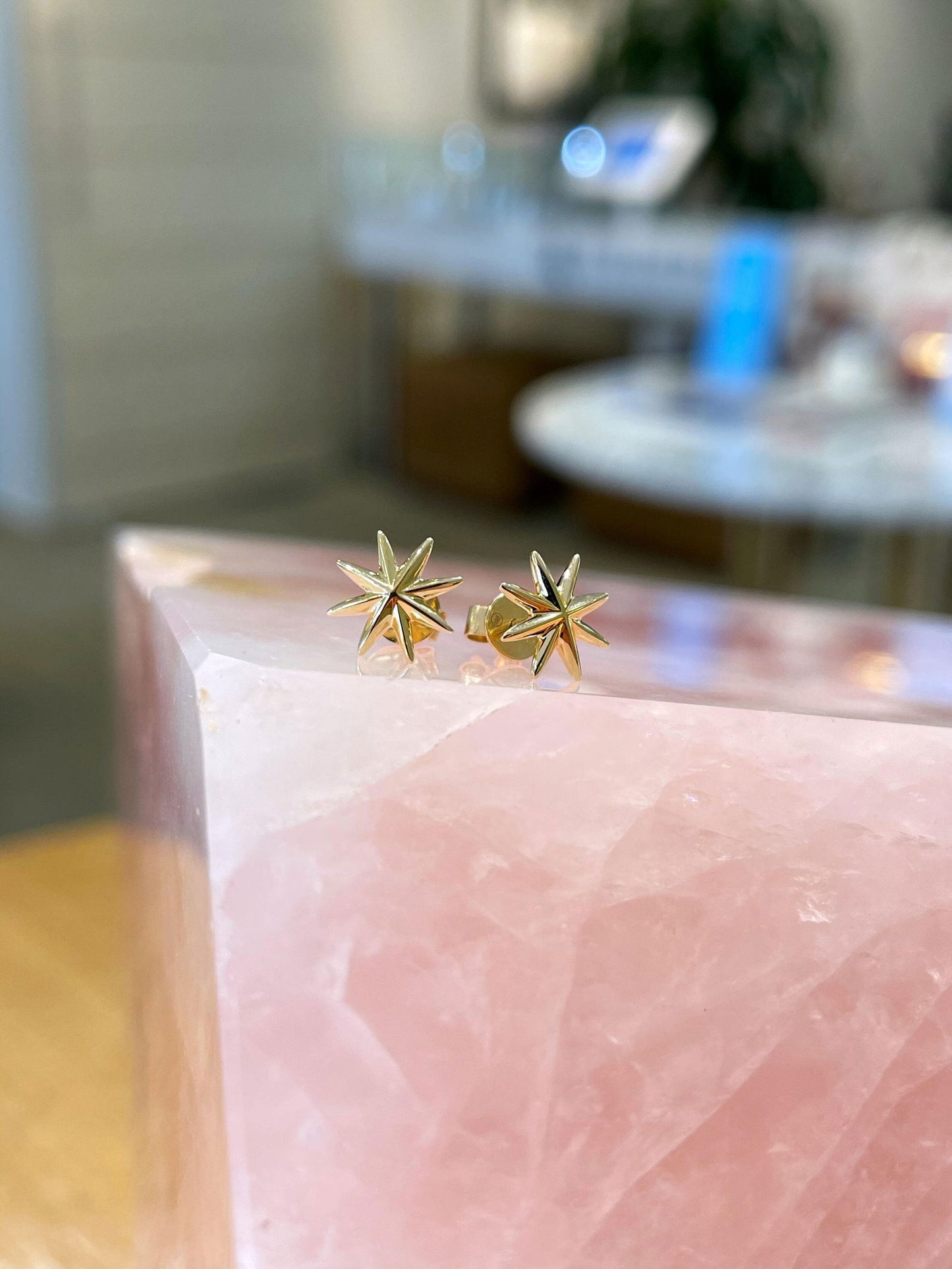 Photo of Star Burst Studs in a decorative scene, designed by , available at Plumb Gold & Plumb Silver