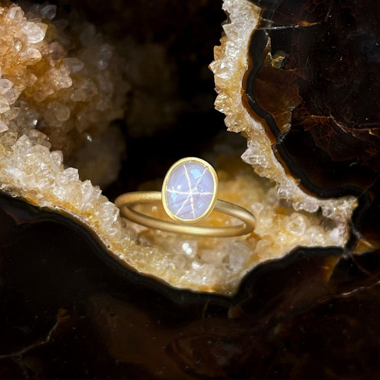 Photo of Star Sapphire Yumdrop in a decorative scene, designed by , available at Plumb Gold & Plumb Silver