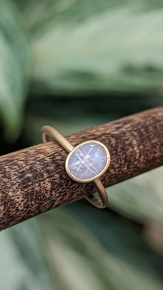 Photo of Star Sapphire Yumdrop in a decorative scene, designed by , available at Plumb Gold & Plumb Silver