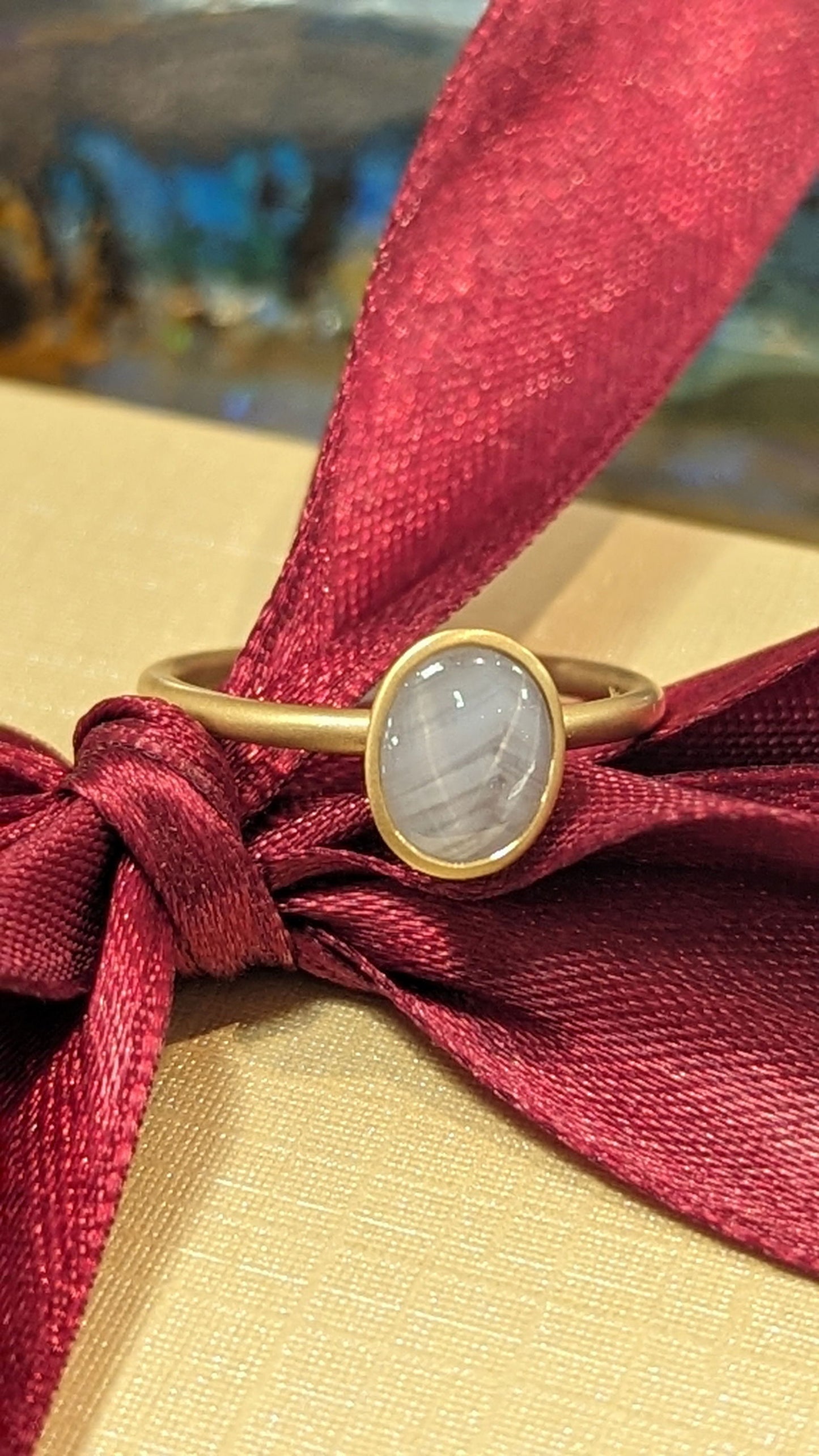 Photo of Star Sapphire Yumdrop in a decorative scene, designed by , available at Plumb Gold & Plumb Silver