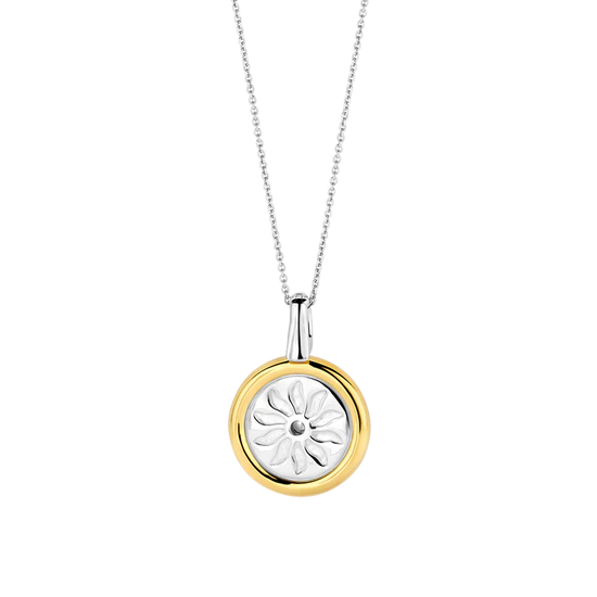 Photo of Summer Sun Coin Pendant in a decorative scene, designed by , available at Plumb Gold & Plumb Silver