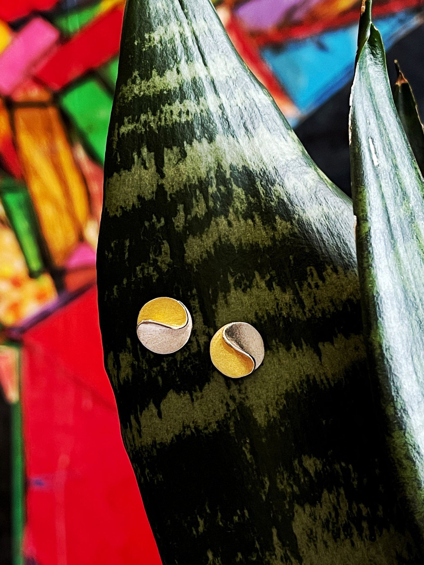 Photo of "Sun" Earrings in a decorative scene, designed by , available at Plumb Gold & Plumb Silver