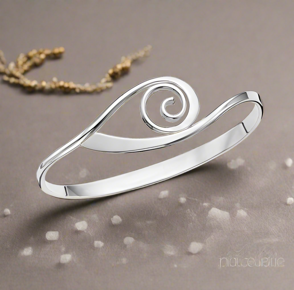 Photo of "Swell Swing" Bracelet in a decorative scene, designed by , available at Plumb Gold & Plumb Silver