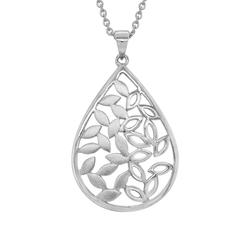 Photo of Teardrop Leaf Necklace in a decorative scene, designed by , available at Plumb Gold & Plumb Silver