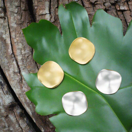 Photo of The "Aqua" Studs in a decorative scene, designed by -, available at Plumb Gold & Plumb Silver