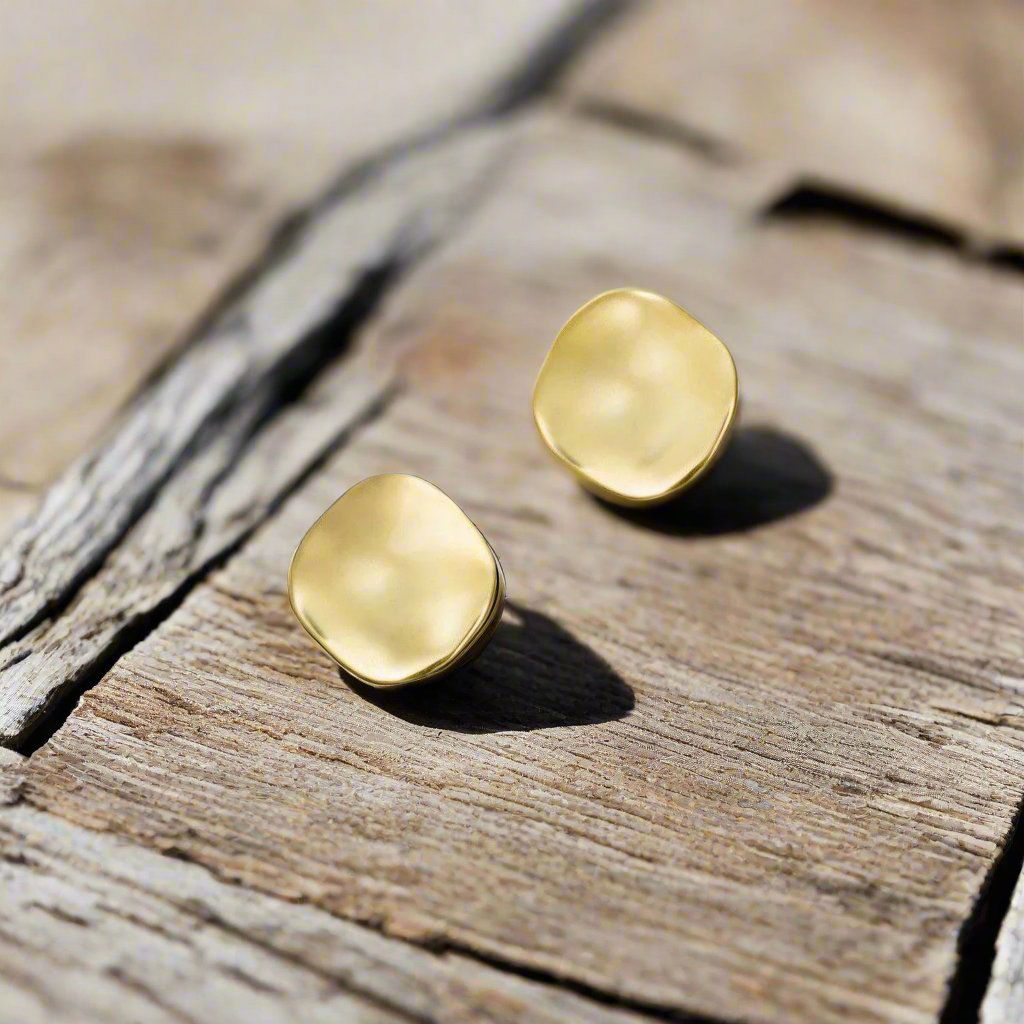 Photo of The "Aqua" Studs in a decorative scene, designed by -, available at Plumb Gold & Plumb Silver