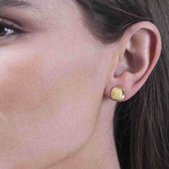 Photo of The "Aqua" Studs in a decorative scene, designed by -, available at Plumb Gold & Plumb Silver