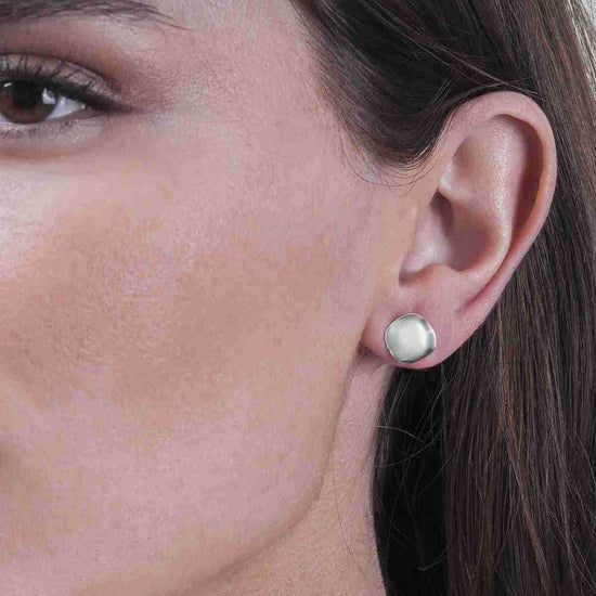 Photo of The "Aqua" Studs in a decorative scene, designed by -, available at Plumb Gold & Plumb Silver