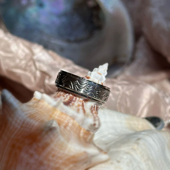 Photo of Titanium Wave Band in a decorative scene, designed by , available at Plumb Gold & Plumb Silver