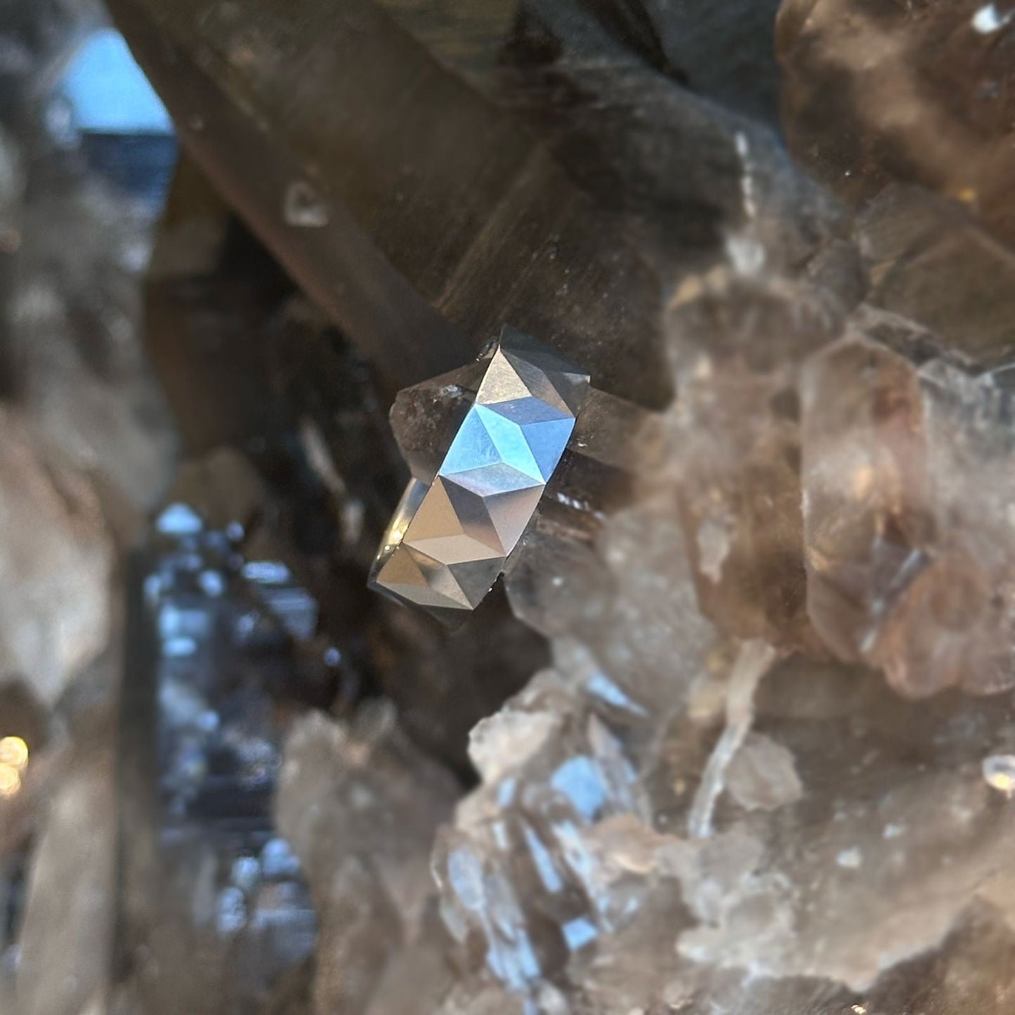 Photo of Tungsten Chevron Faceted Band in a decorative scene, designed by , available at Plumb Gold & Plumb Silver